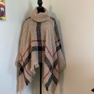 Poncho! Never worn. In excellent condition. No size or tag but I wear a medium.